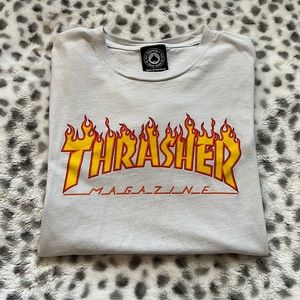 This is a white thrasher magazine T-shirt size small